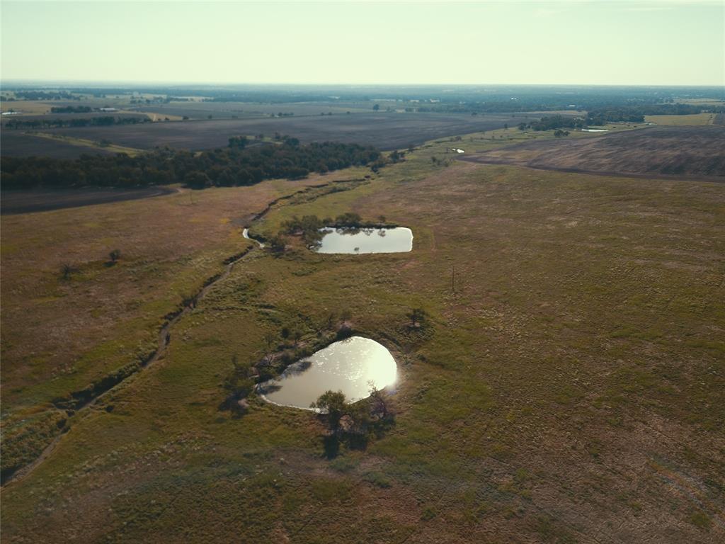405 County Road 405 Lott, TX 76656 - Photo 9 of 9 a view of a lake with a mountain in the background