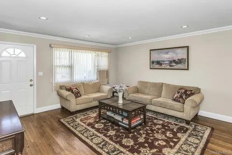 a living room with furniture and a rug