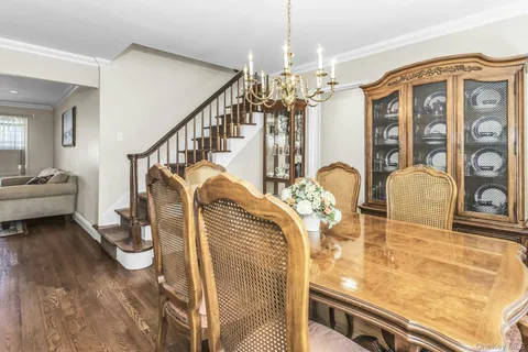 a view of a living room and chandelier