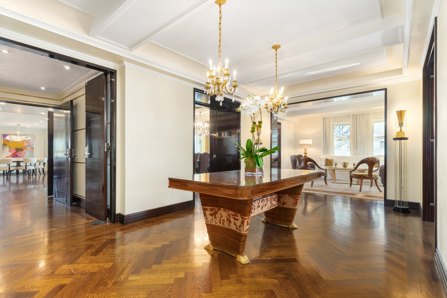 502 Park Avenue, Unit PH22 Manhattan, NY 10022 - Photo 1 of 19 a view of a dining room with furniture window and wooden floor