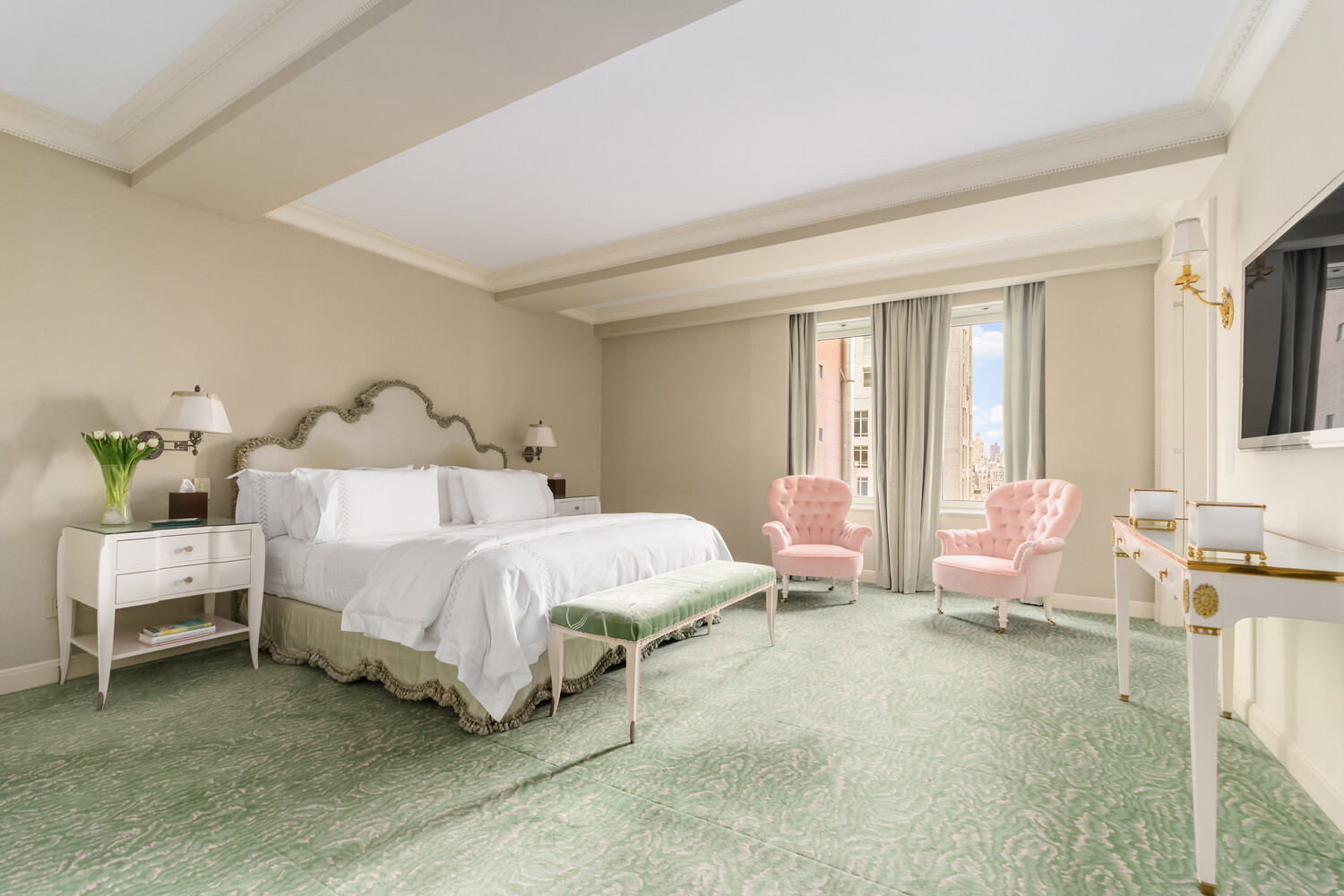 502 Park Avenue, Unit PH22 Manhattan, NY 10022 - Photo 11 of 19 a spacious bedroom with a bed table and chair