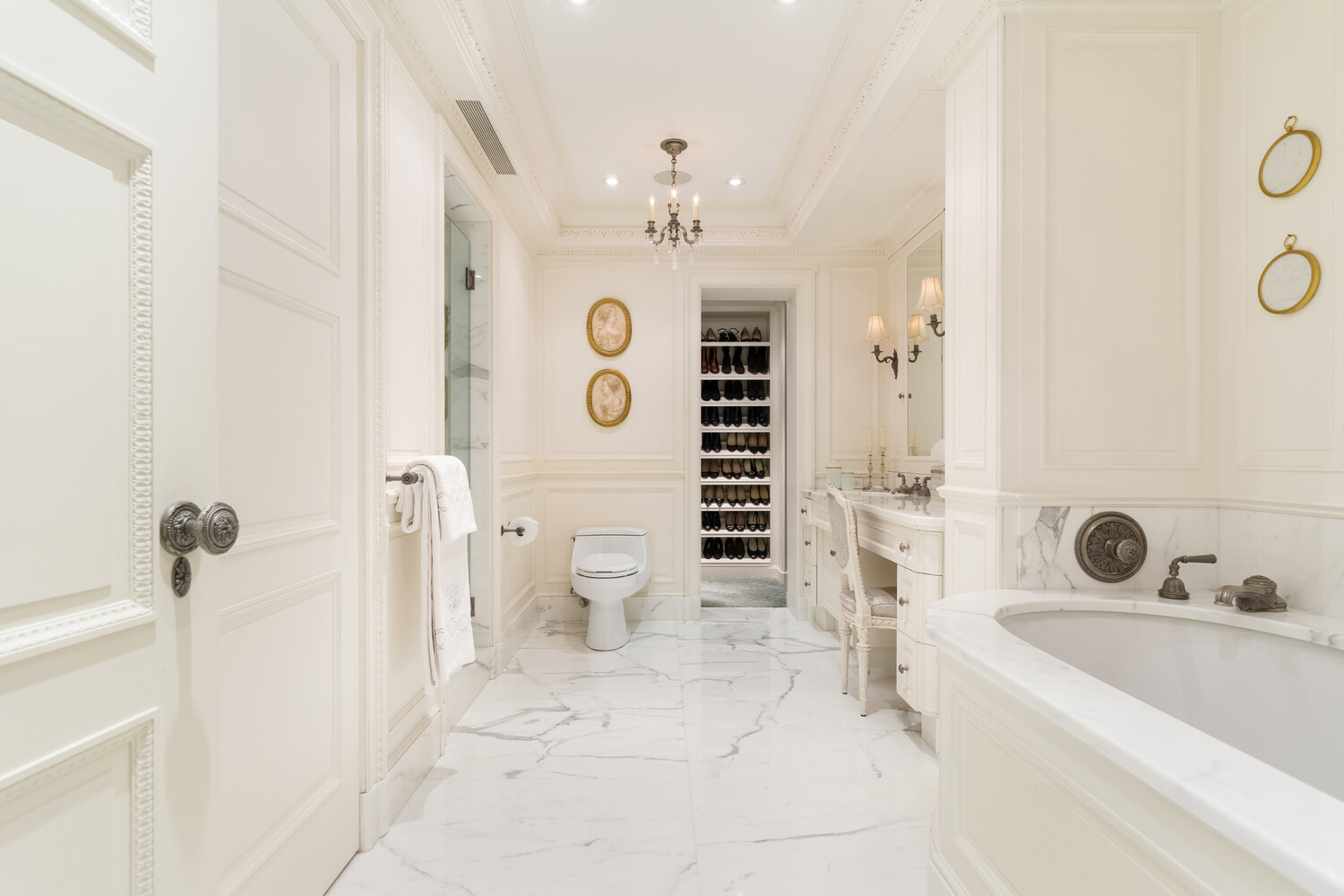 502 Park Avenue, Unit PH22 Manhattan, NY 10022 - Photo 12 of 19 a bathroom with a bathtub sink and toilet