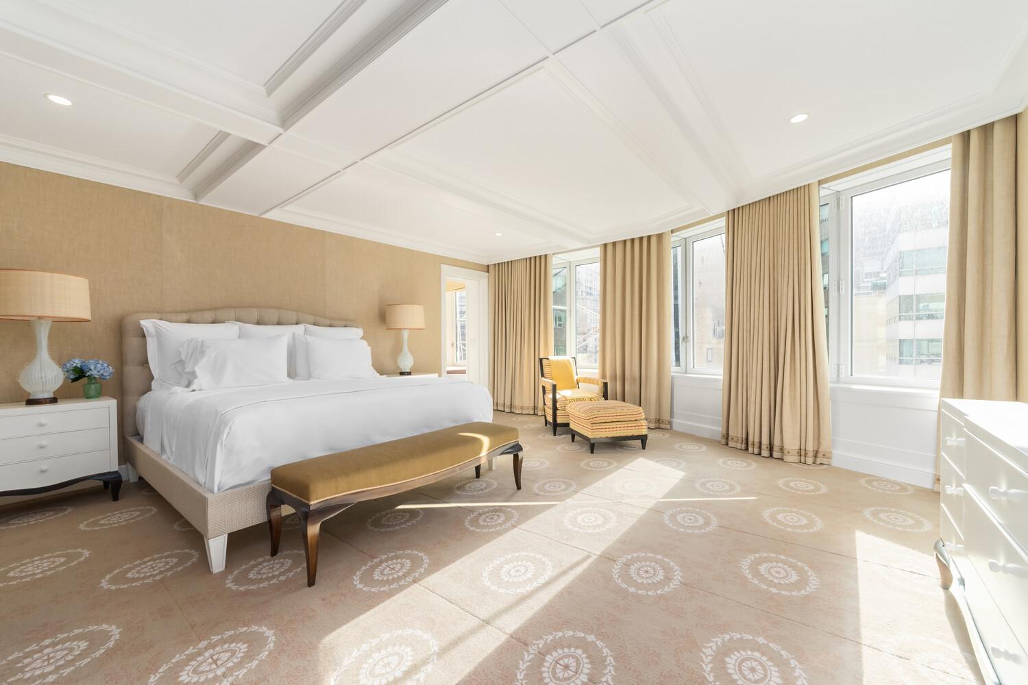 502 Park Avenue, Unit PH22 Manhattan, NY 10022 - Photo 13 of 19 a spacious bedroom with a bed and glass windows