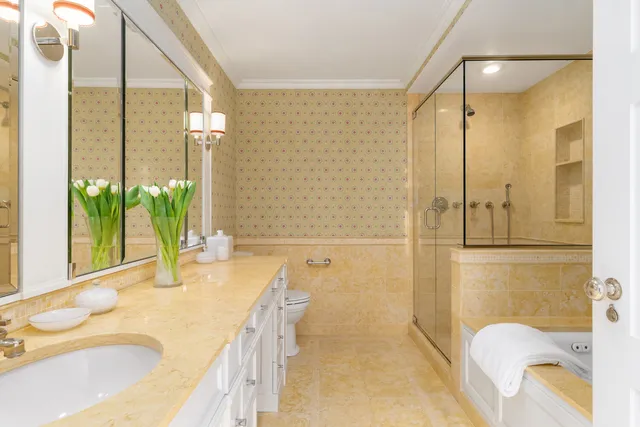 a spacious bedroom with a bed and glass windows