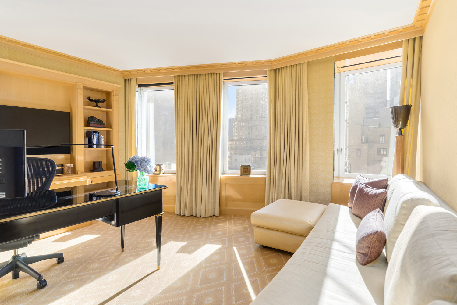502 Park Avenue, Unit PH22 Manhattan, NY 10022 - Photo 15 of 19 a living room with furniture and large windows
