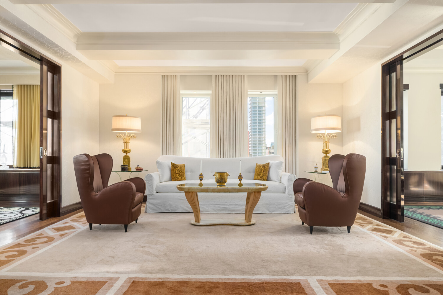 502 Park Avenue, Unit PH22 Manhattan, NY 10022 - Photo 3 of 19 a living room with furniture and a large window