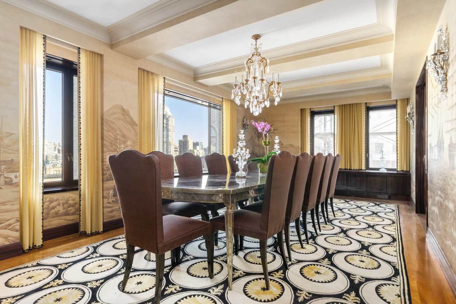 502 Park Avenue, Unit PH22 Manhattan, NY 10022 - Photo 5 of 19 a view of a dining room with furniture and a chandelier