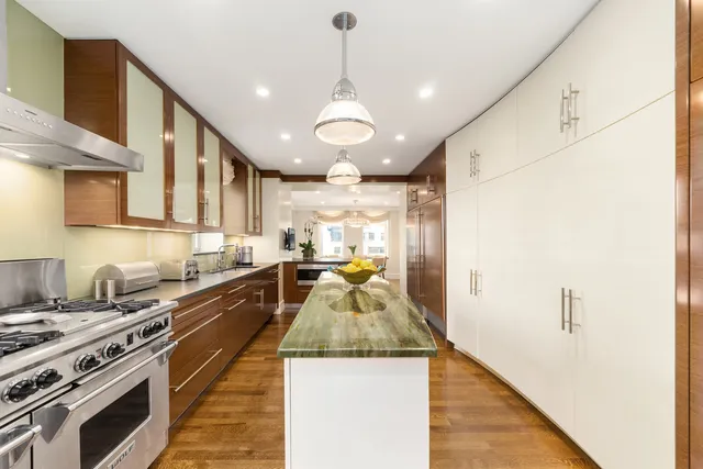 a view of a dining room with furniture wooden floor and chandelier