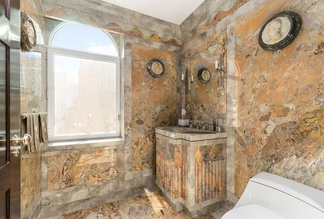 a large kitchen with stainless steel appliances granite countertop a lot of counter space