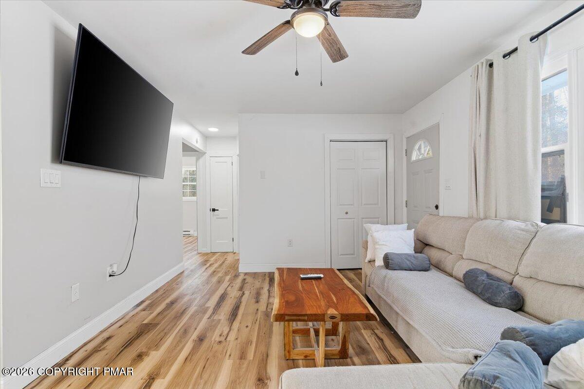 3279 Beech Ridge Drive Pocono Summit, PA 18346 - Photo 11 of 37 a living room with furniture and a flat screen tv
