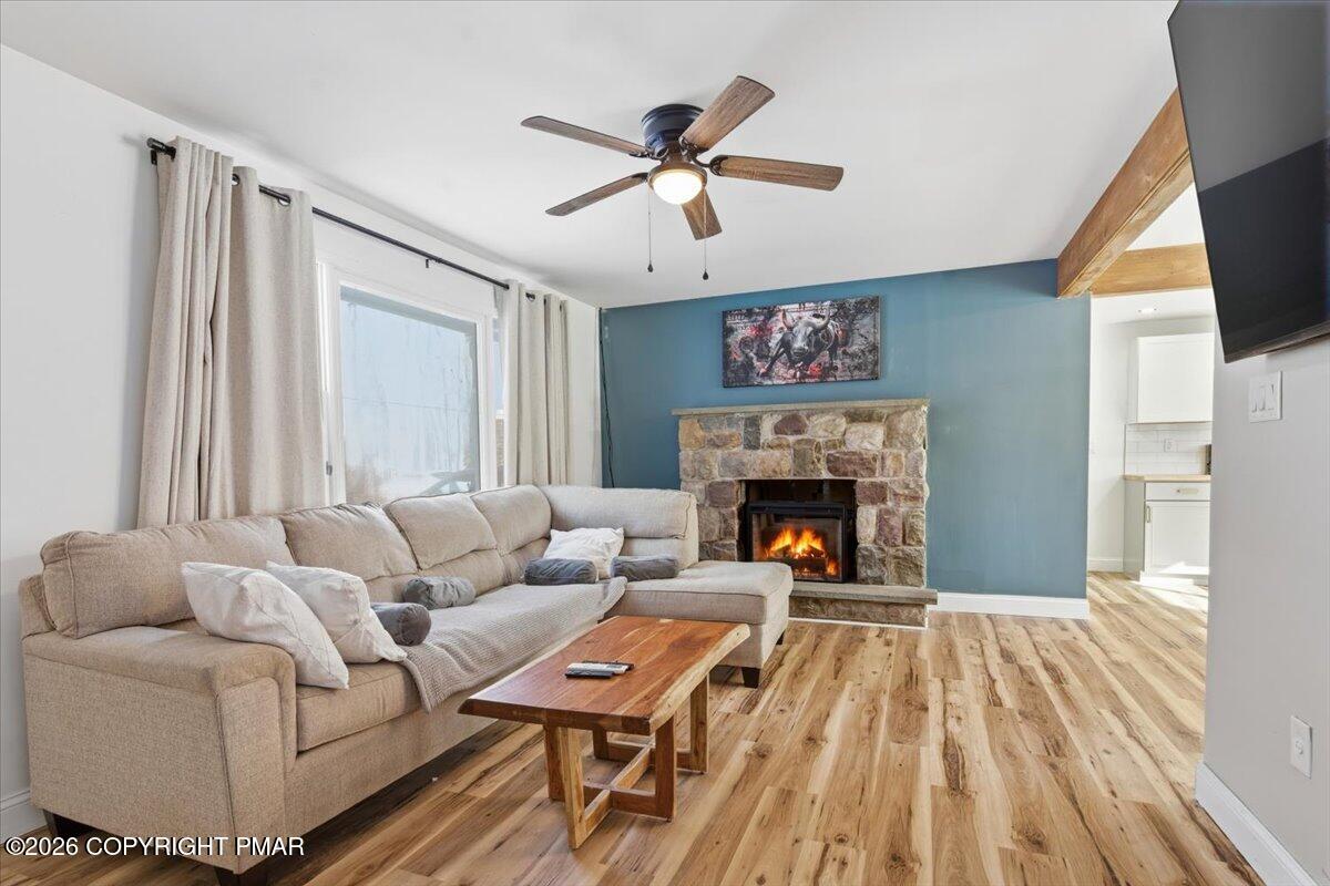 3279 Beech Ridge Drive Pocono Summit, PA 18346 - Photo 12 of 37 a living room with furniture and a fireplace