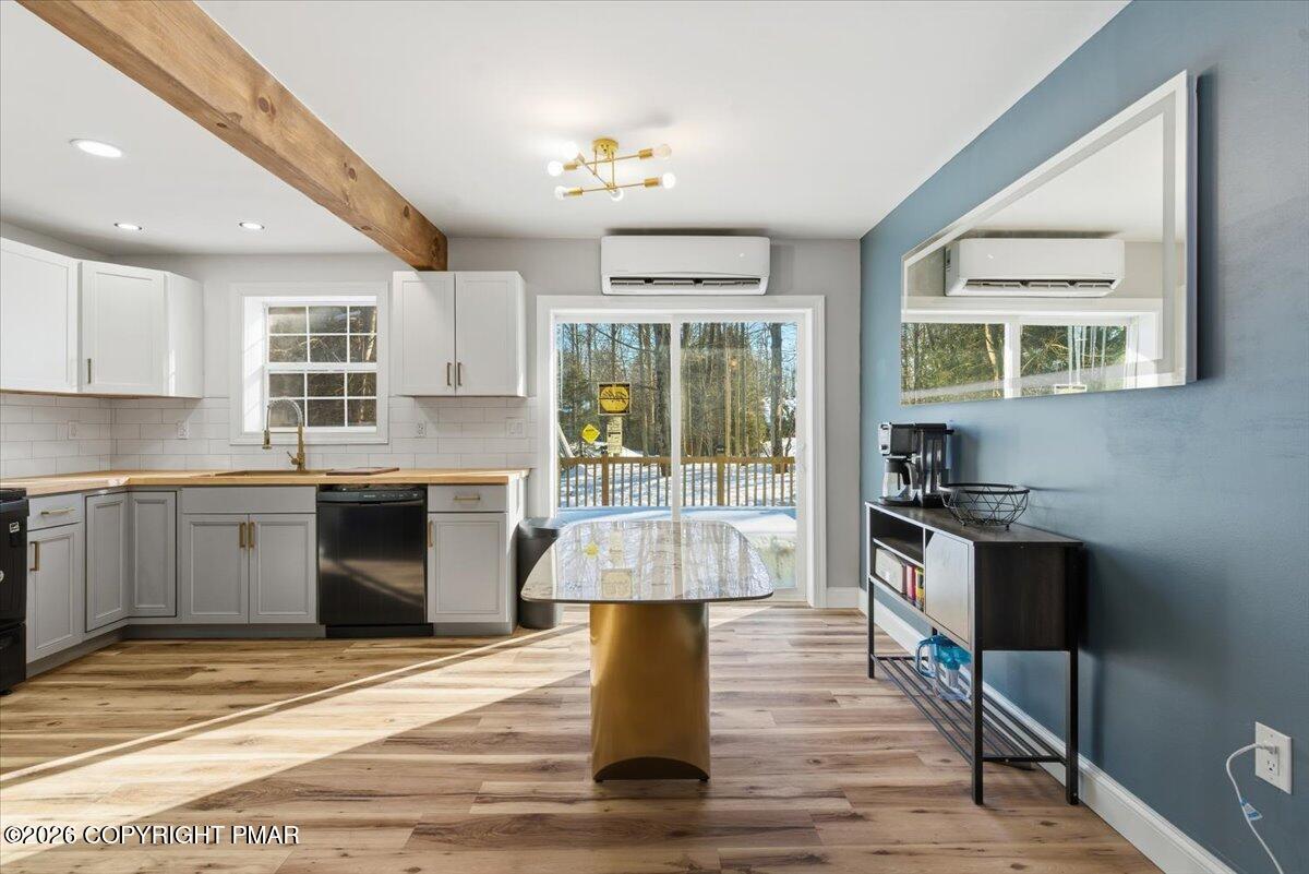 3279 Beech Ridge Drive Pocono Summit, PA 18346 - Photo 16 of 37 a kitchen with kitchen island granite countertop a stove and a sink