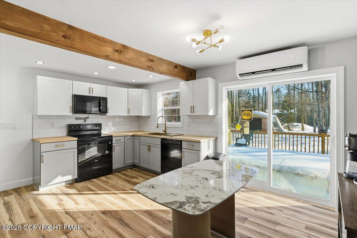 3279 Beech Ridge Drive Pocono Summit, PA 18346 - Photo 17 of 37 a kitchen with a stove a sink and a refrigerator
