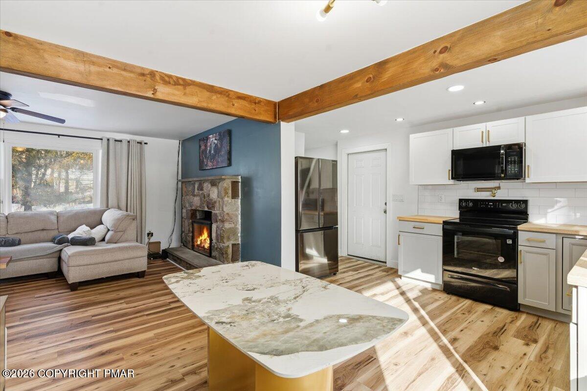 3279 Beech Ridge Drive Pocono Summit, PA 18346 - Photo 18 of 37 a large bedroom with a bed and flat screen tv