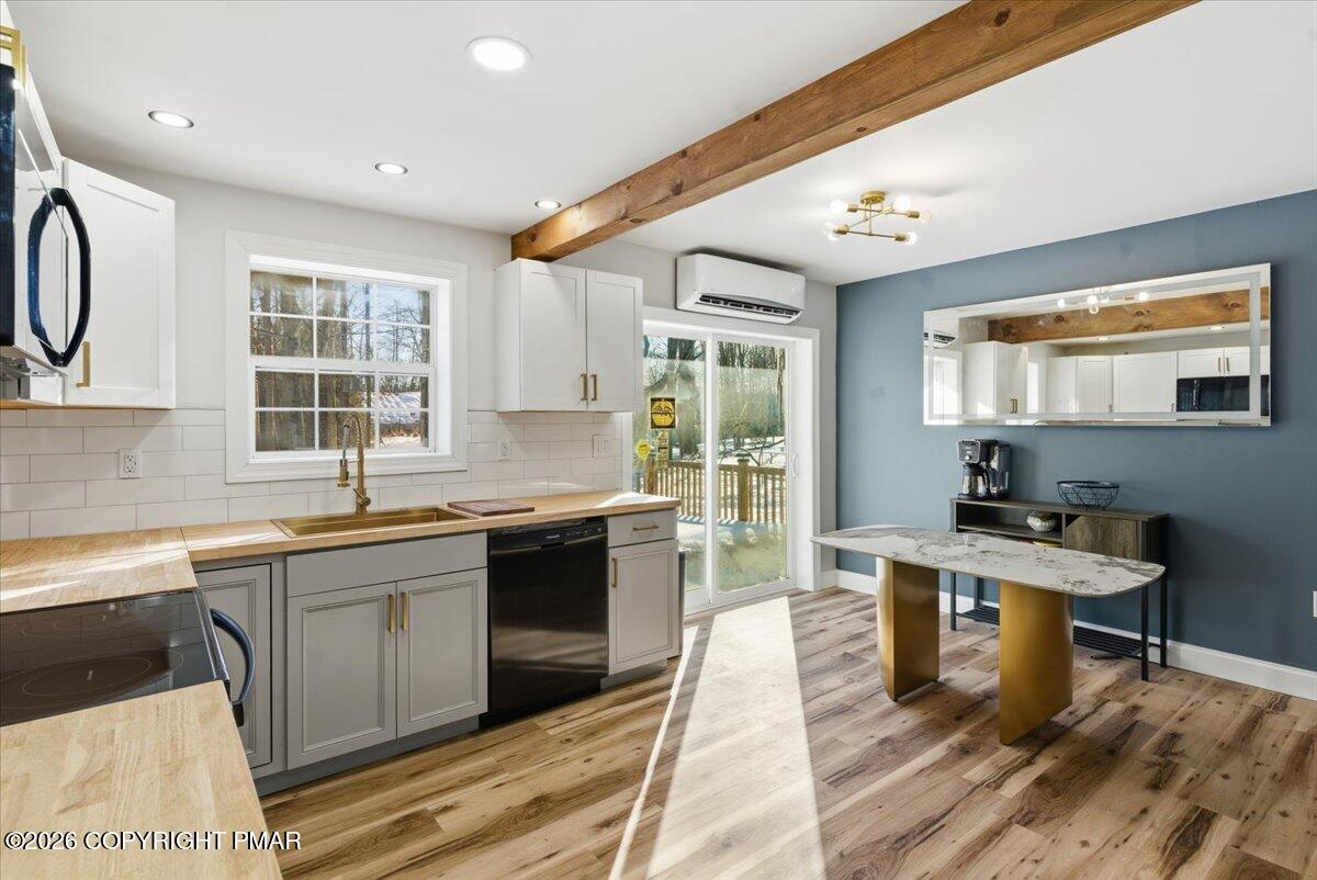 3279 Beech Ridge Drive Pocono Summit, PA 18346 - Photo 23 of 37 a kitchen with a sink stove and cabinets