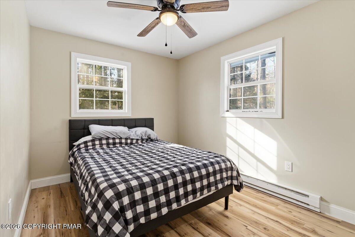 3279 Beech Ridge Drive Pocono Summit, PA 18346 - Photo 27 of 37 a bedroom with a bed and window