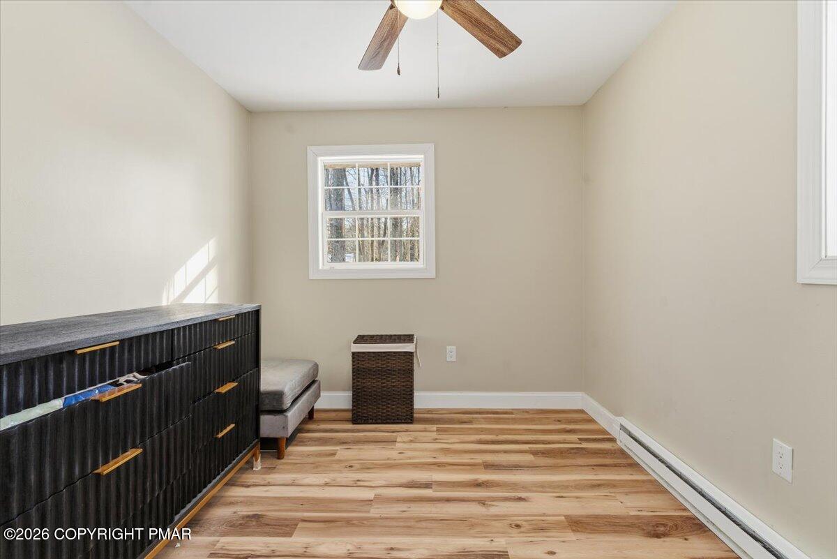 3279 Beech Ridge Drive Pocono Summit, PA 18346 - Photo 29 of 37 a view of an empty room with wooden floor and a window