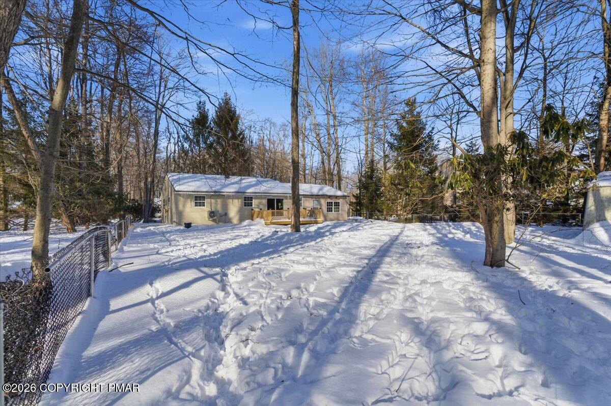 3279 Beech Ridge Drive Pocono Summit, PA 18346 - Photo 3 of 37 a view of a yard with plants and trees