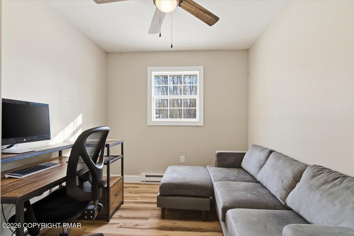3279 Beech Ridge Drive Pocono Summit, PA 18346 - Photo 33 of 37 a livingroom with workspace and a window