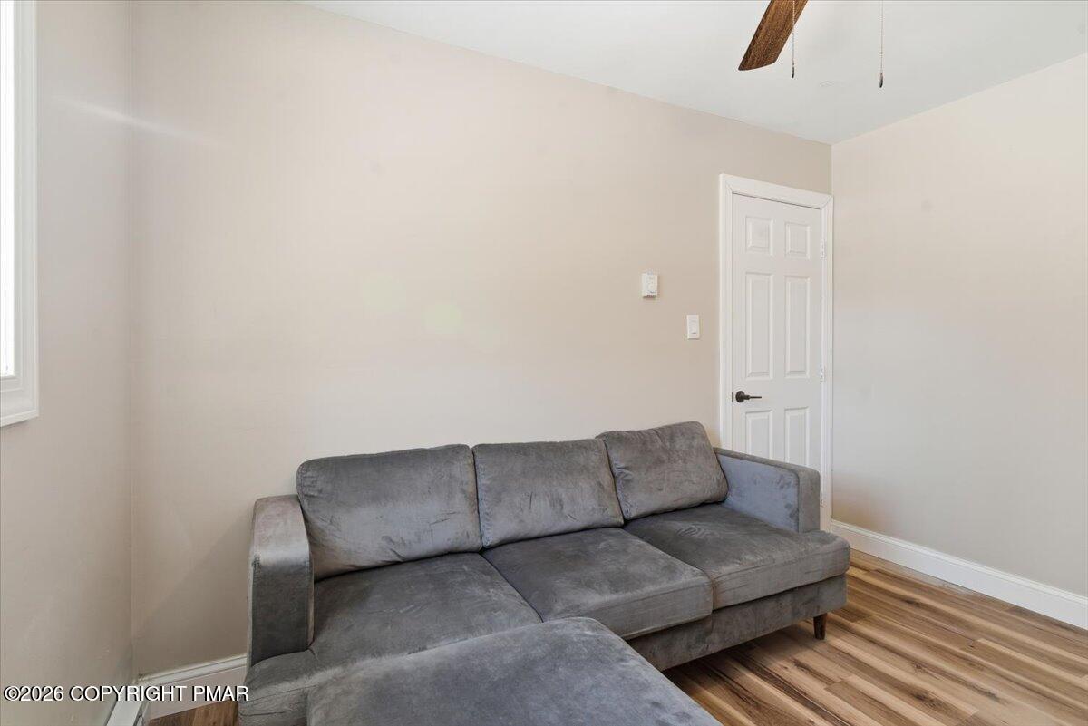 3279 Beech Ridge Drive Pocono Summit, PA 18346 - Photo 35 of 37 a living room with furniture and a potted plant