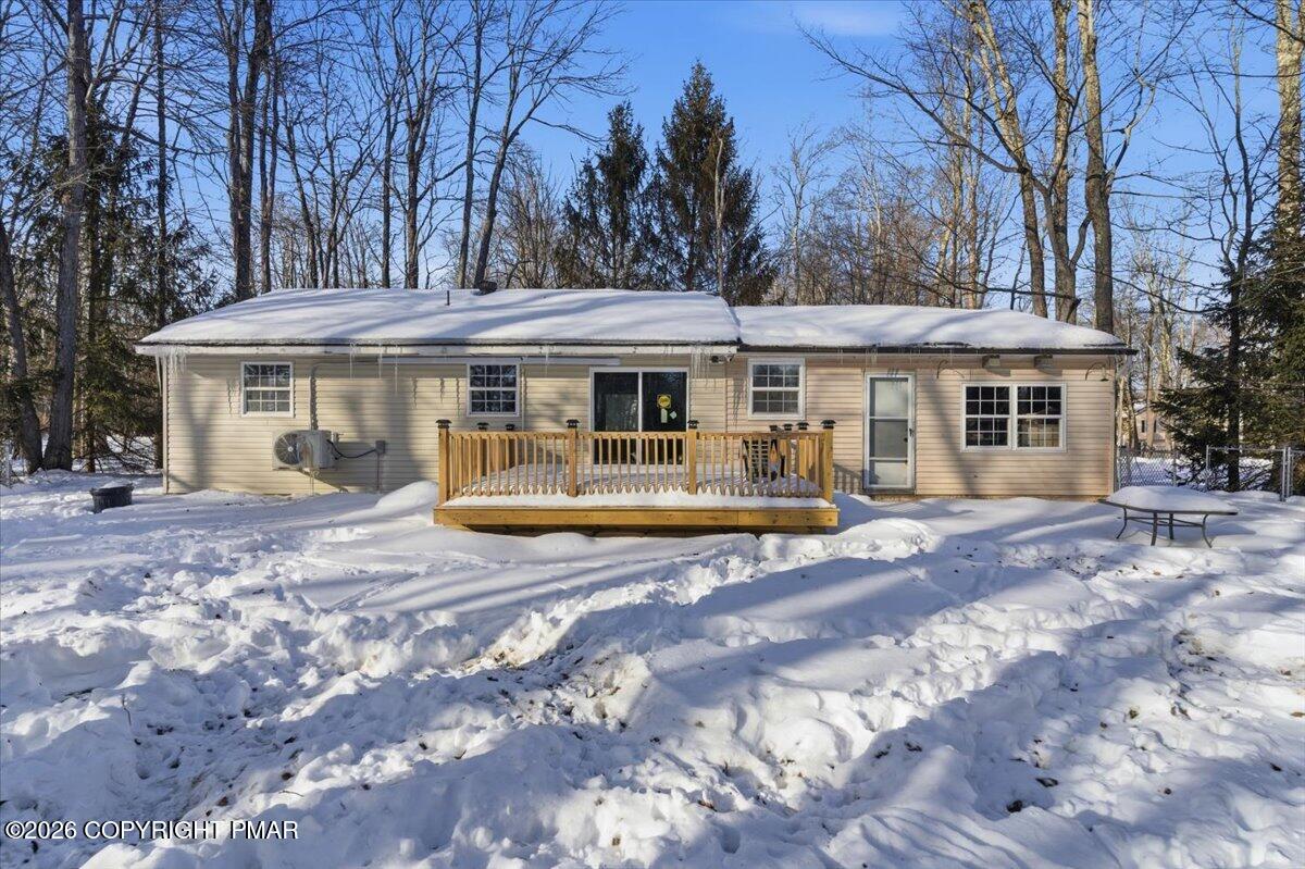 3279 Beech Ridge Drive Pocono Summit, PA 18346 - Photo 4 of 37 a view of a white house with a large tree and large trees