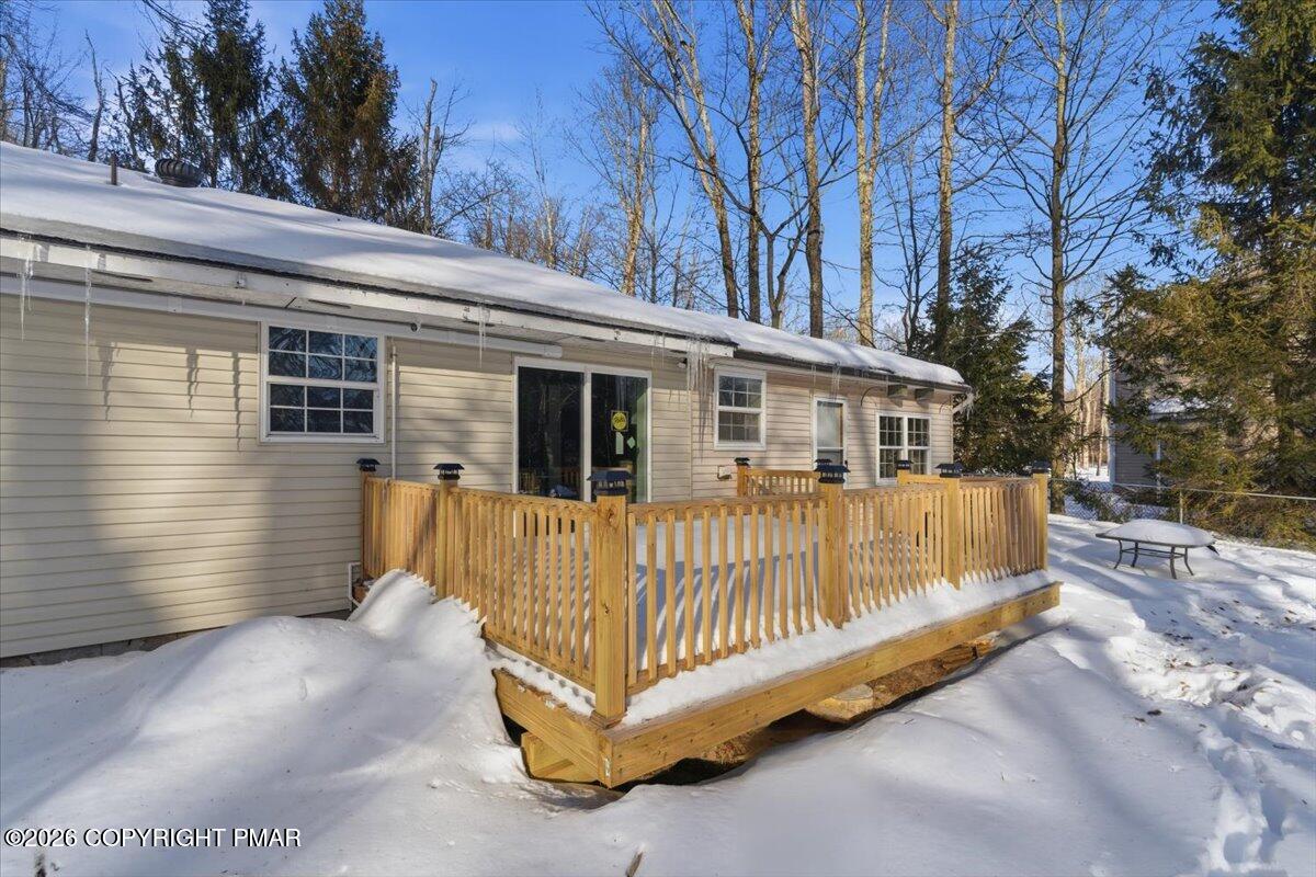 3279 Beech Ridge Drive Pocono Summit, PA 18346 - Photo 5 of 37 a view of a house with a wooden fence