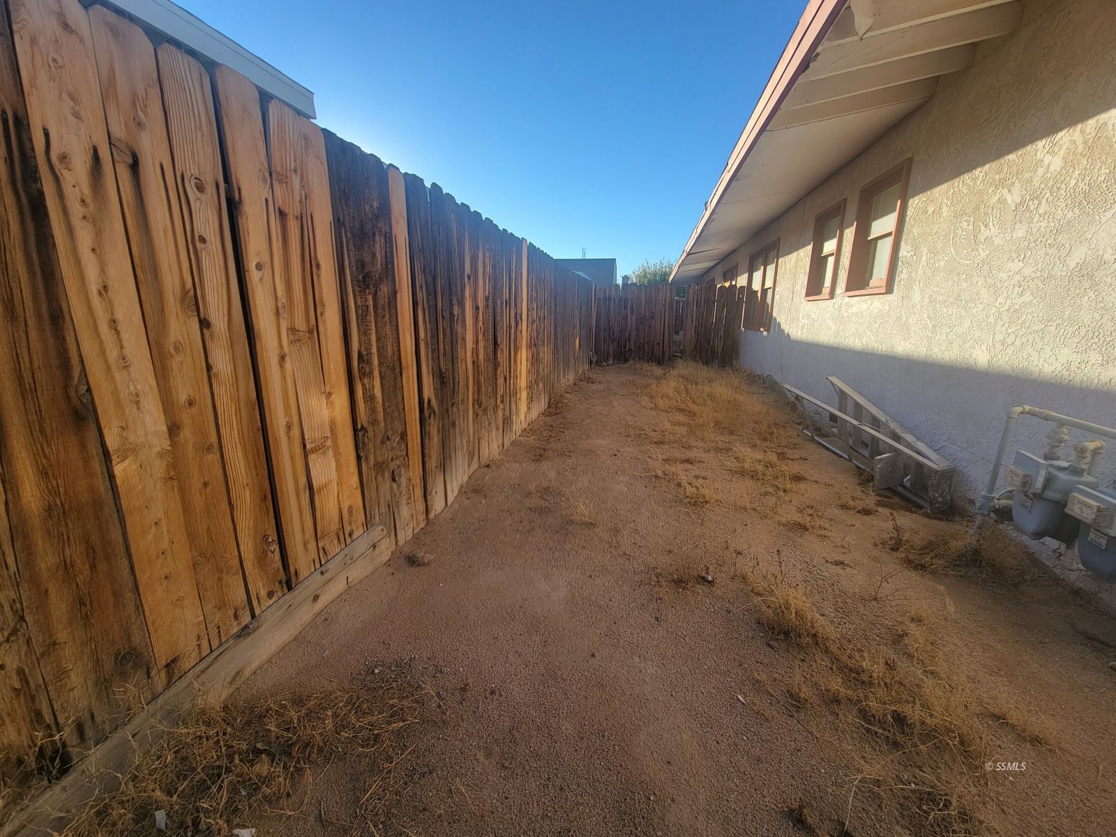 405 South Richmond Road Ridgecrest, CA 93555 - Photo 11 of 22 a view of a house with a backyard