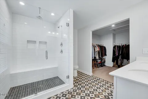 a bathroom with a bathtub and a shower
