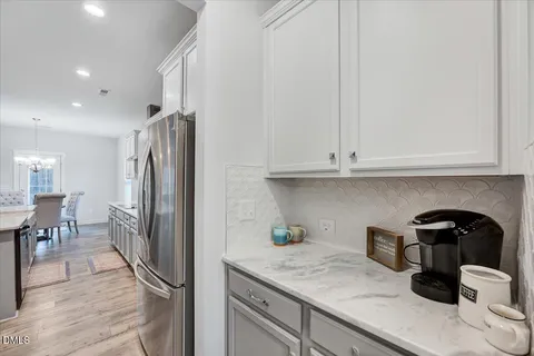 a kitchen with appliances and cabinets