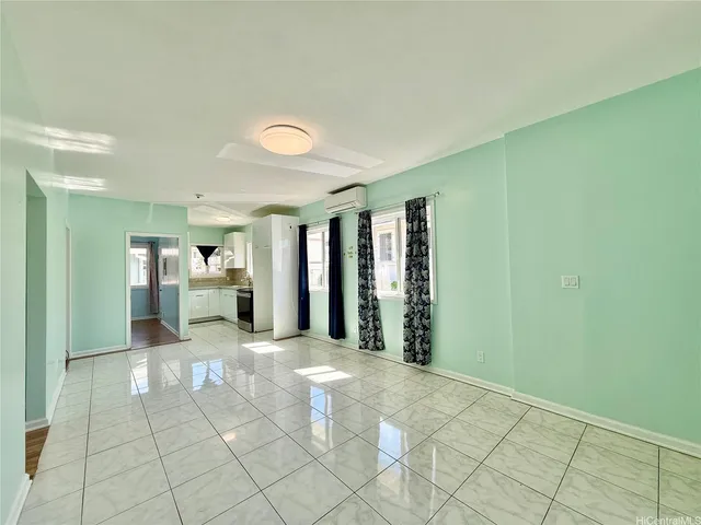 a view of a room with furniture and a window