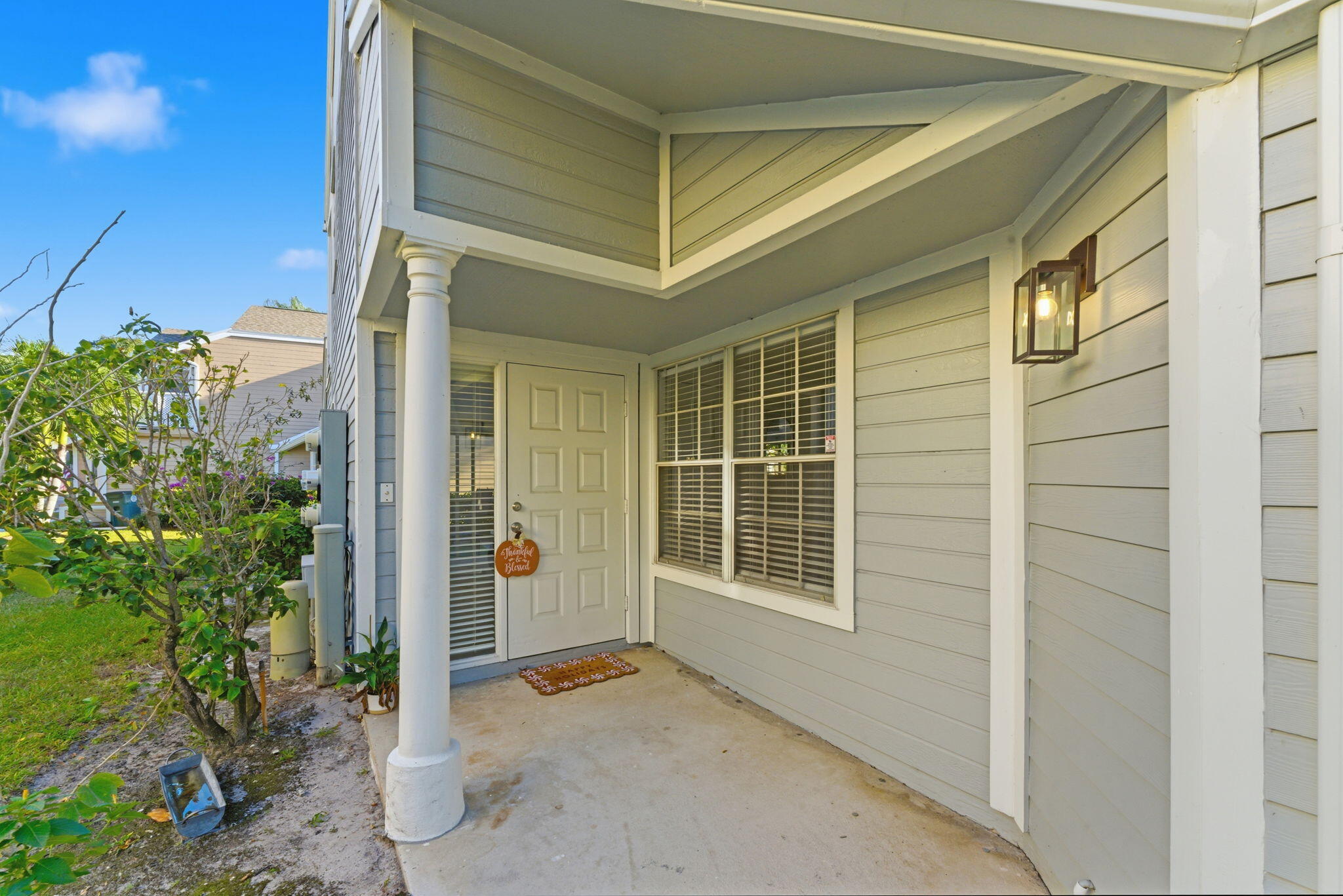 5332 Buckhead Circle, Unit 1010 Boca Raton, FL 33431 - Photo 5 of 30 a view of a house with a door and potted plants