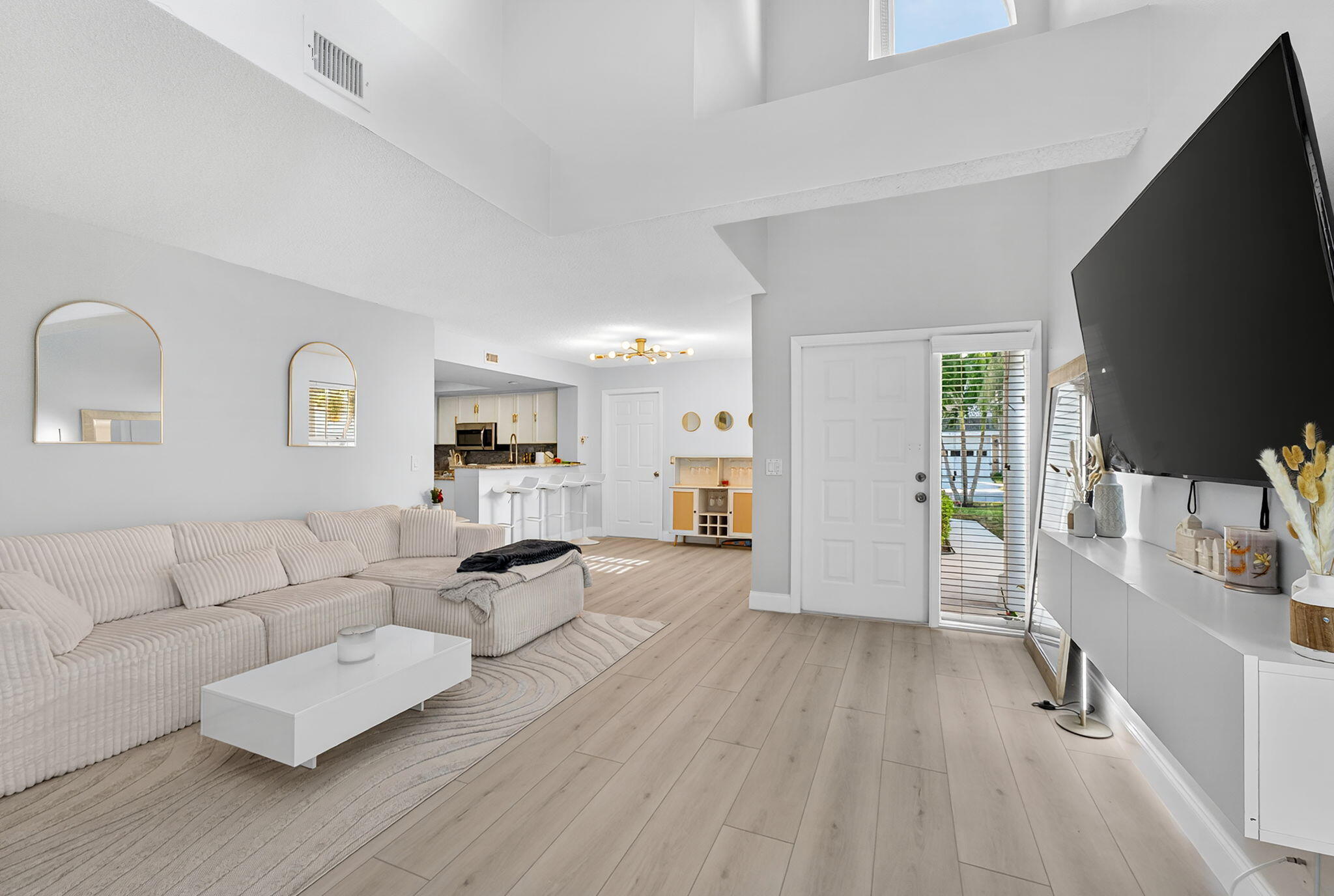 5332 Buckhead Circle, Unit 1010 Boca Raton, FL 33431 - Photo 8 of 30 a living room with furniture and a flat screen tv