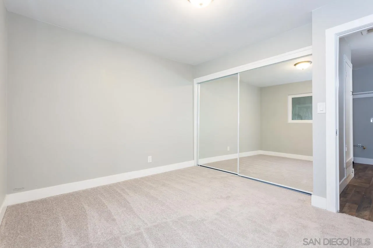 12055 Royal Road El Cajon, CA 92021 - Photo 15 of 34 an empty room with sliding glass door