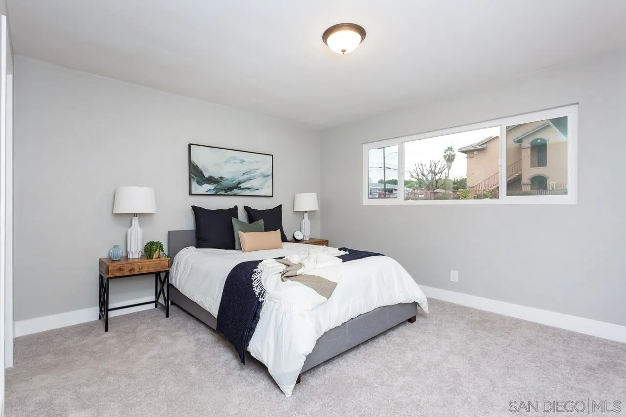 12055 Royal Road El Cajon, CA 92021 - Photo 17 of 34 a bedroom with a bed and a painting on the wall