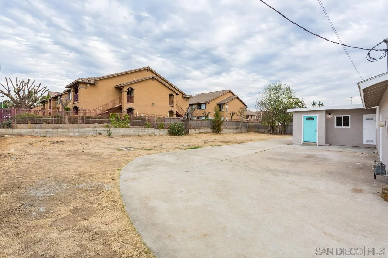 12055 Royal Road El Cajon, CA 92021 - Photo 20 of 34 a front view of a house with a yard