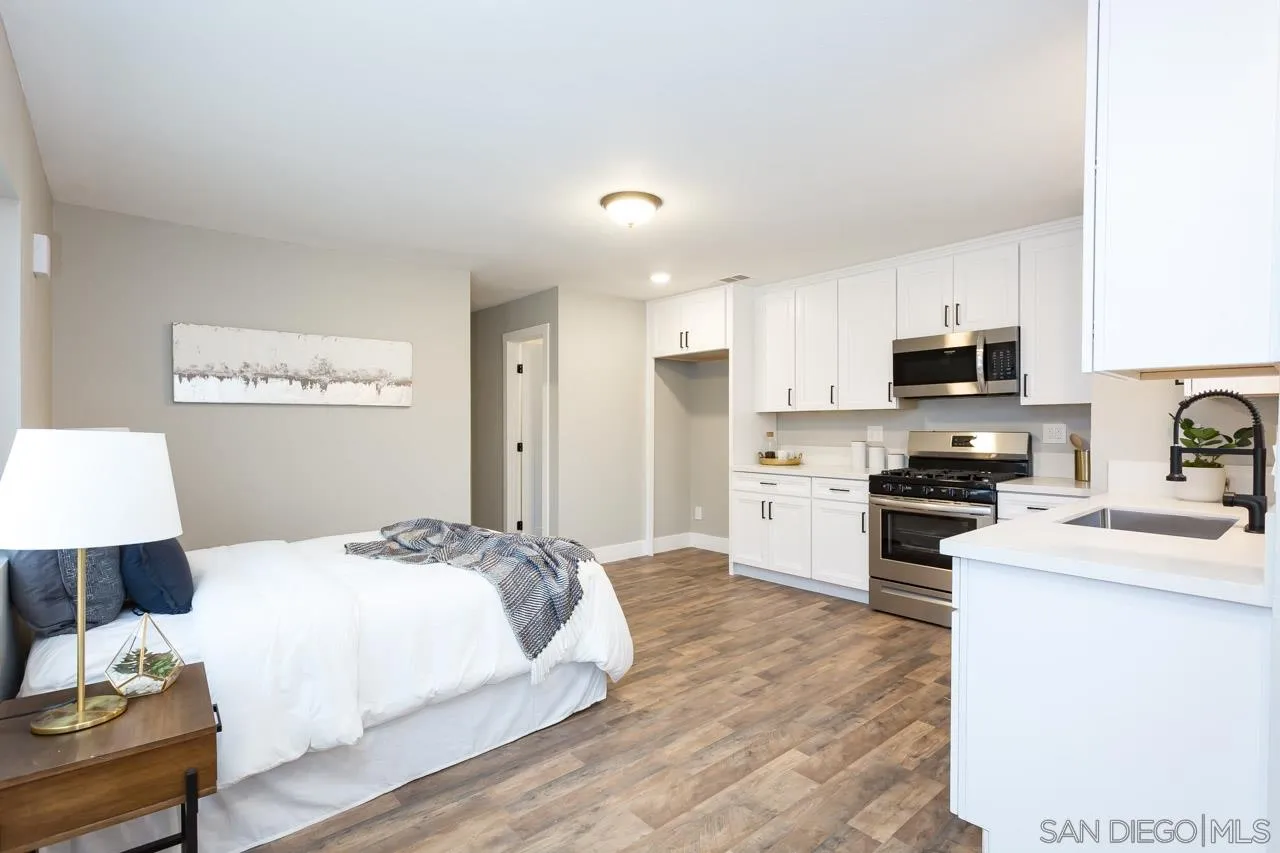 12055 Royal Road El Cajon, CA 92021 - Photo 23 of 34 a bedroom with a bed and a television