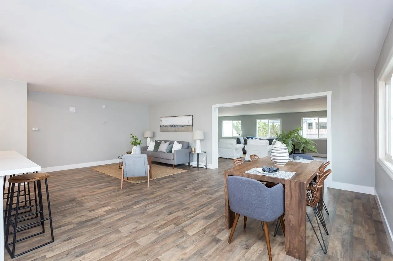 12055 Royal Road El Cajon, CA 92021 - Photo 3 of 34 a view of a dining room with furniture window and wooden floor