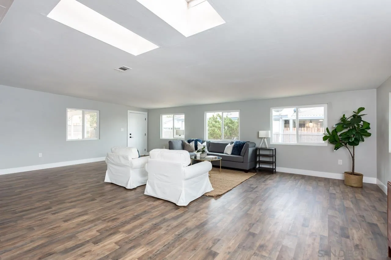 12055 Royal Road El Cajon, CA 92021 - Photo 7 of 34 a living room with furniture and a large window