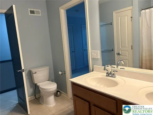 a bathroom with a sink toilet and vanity