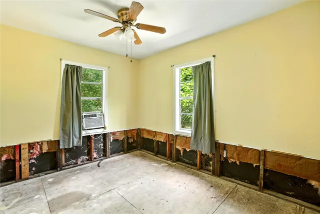 a view of a bedroom with window