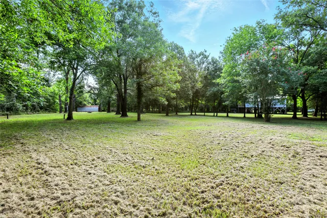 a view of outdoor space with deck and yard