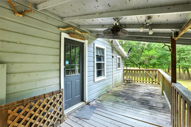 a view of balcony with wooden floor