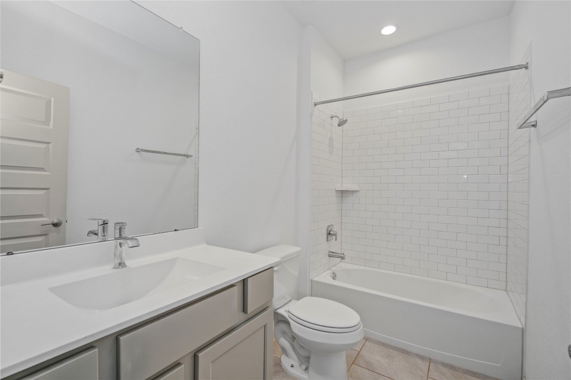 29847 Reagans Ranch Drive Katy, TX 77494 - Photo 15 of 36 a bathroom with a sink toilet vanity and shower