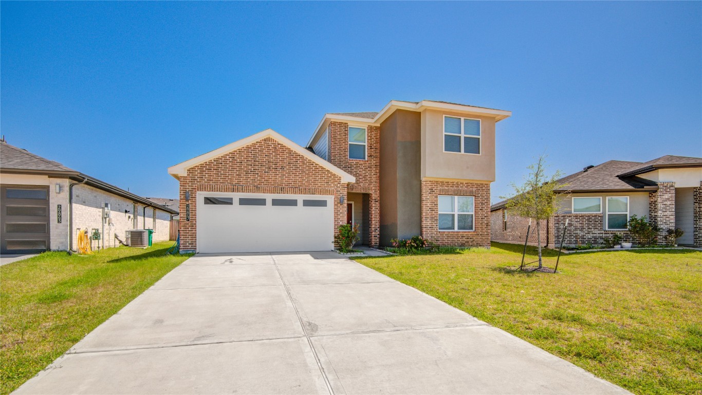29847 Reagans Ranch Drive Katy, TX 77494 - Photo 4 of 36 a front view of house with yard and garage