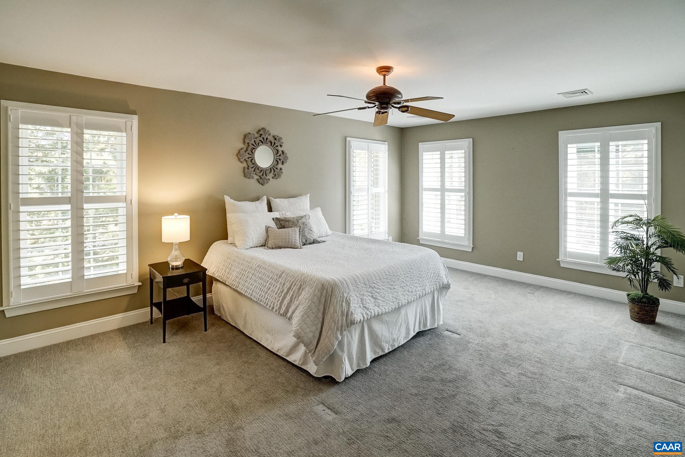 3536 Preddy Creek Road Charlottesville, VA 22911 - Photo 27 of 68 Primary suite with ceiling fan features a large walk in closet, and ensuite bathroom.
