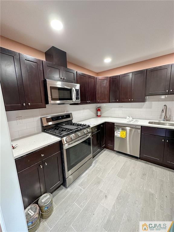 4301 Hana Road Edison, NJ 08817 - Photo 8 of 37 a kitchen with stainless steel appliances granite countertop a stove a sink and a refrigerator