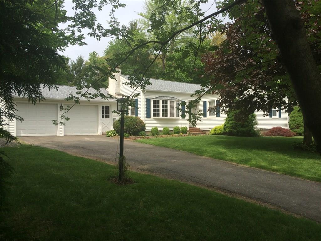 22 Buckwheat Hill Road Watertown, CT 06795 - Photo 1 of 1 a front view of a house with a garden and trees