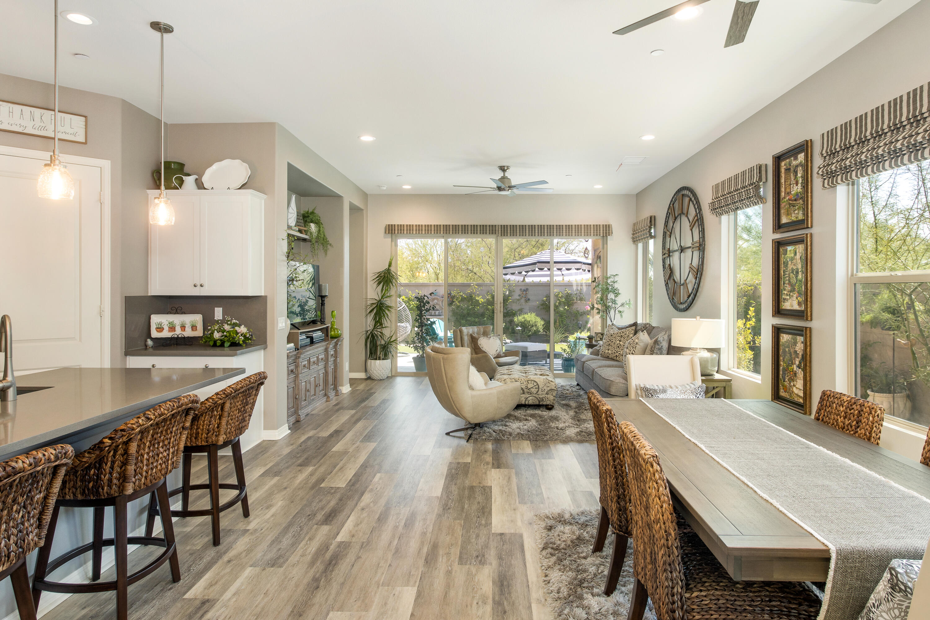 61 Syrah Rancho Mirage, CA 92270 - Photo 16 of 61 a living room with furniture a large window and wooden floor