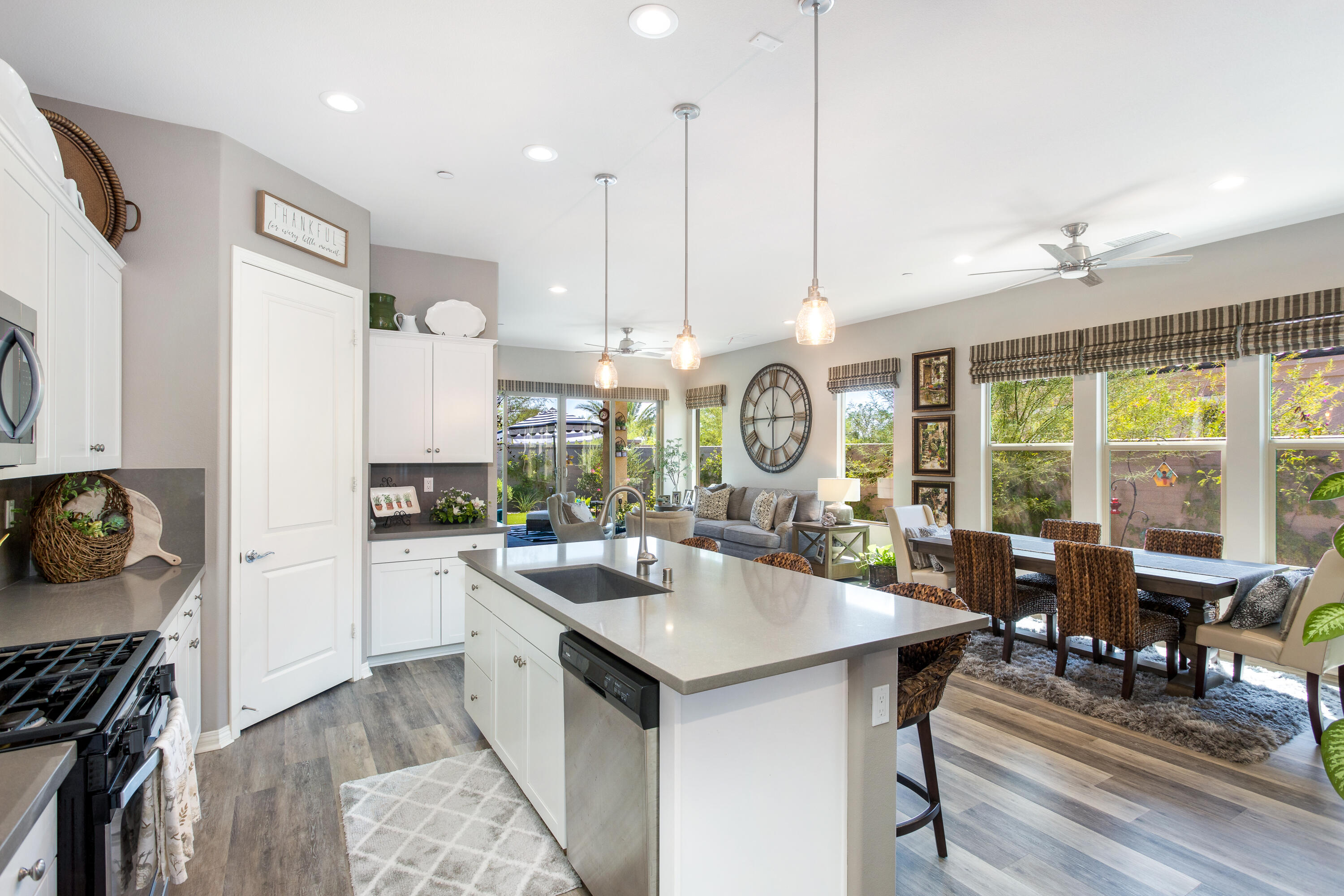 61 Syrah Rancho Mirage, CA 92270 - Photo 19 of 61 a open kitchen with stainless steel appliances granite countertop a stove and a view of living room