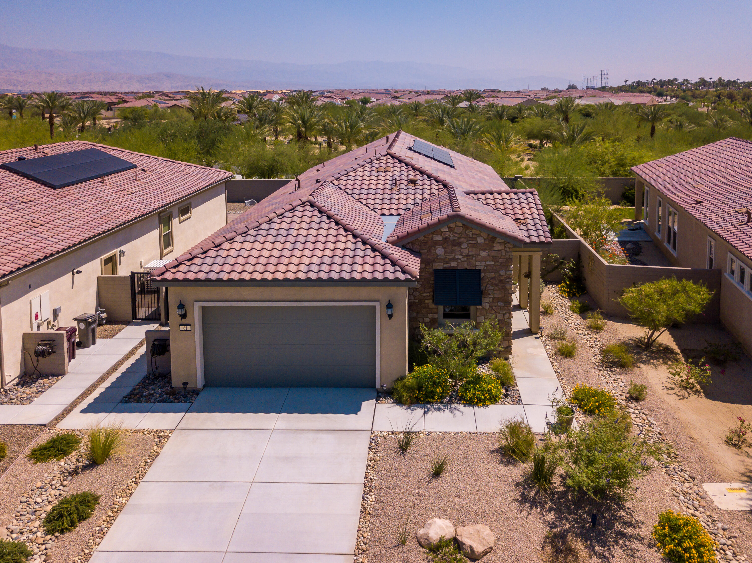 61 Syrah Rancho Mirage, CA 92270 - Photo 2 of 61 a front view of a house with a yard and mountain